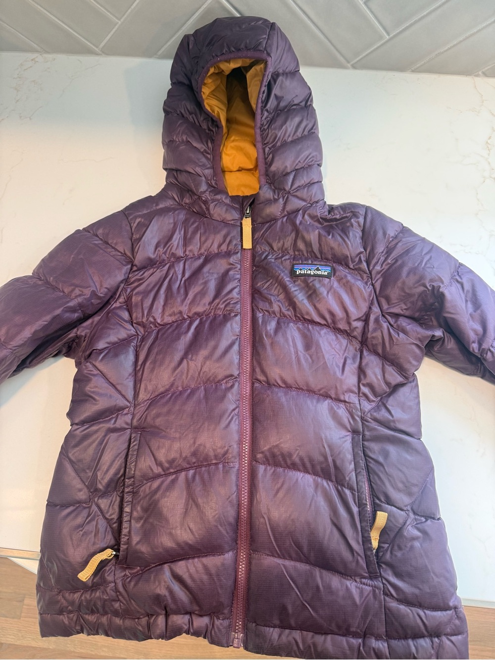 Patagonia girls Purple Hooded Puffer with Yellow Lining. Size xs (5-6)
